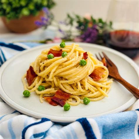 Creamy Pasta with Bacon and Peas - Deliciously Rushed