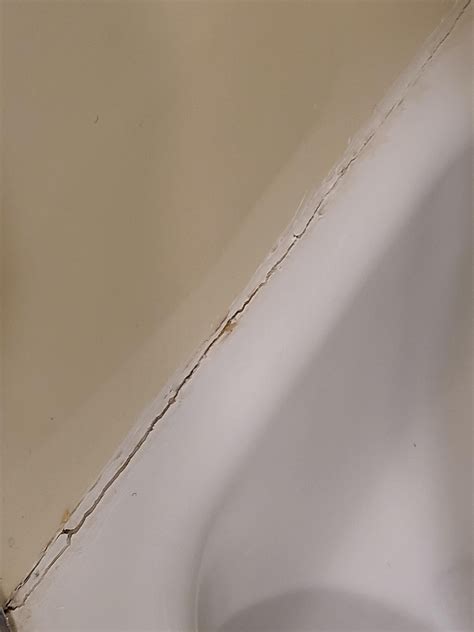 Recaulking a fiberglass shower surround : r/DIY