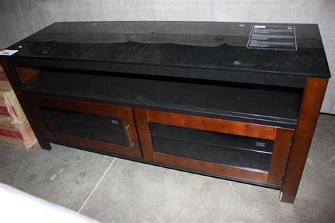 INSIGNIA DARK WOOD GLASS TOP MODERN TV STAND - Able Auctions