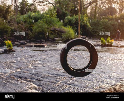 Tires that were made into swings Stock Photo - Alamy