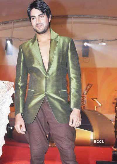A model walks the ramp during a fashion show at the New Year bash ...