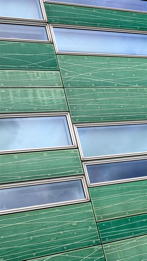 Download wallpaper 938x1668 building, facade, panels, windows, green ...