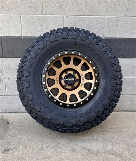 Wheel & Tire Method MR305 17X8.5 5X127 Bronze Wheels & 33X12.50R17 Toyo ...