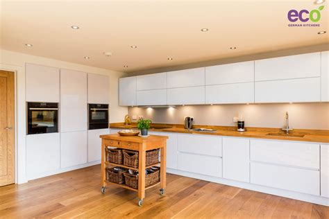 Stunning Handle less High Gloss White kitchen with Solid Wood Worktop ...