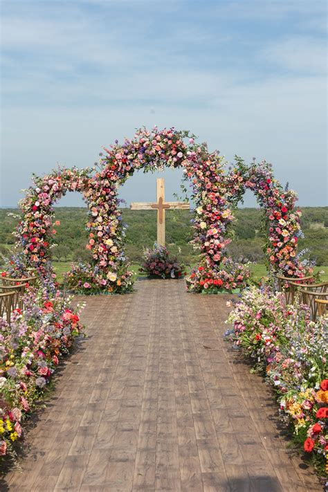 Heavenly Floral Display: A Stunning Wedding Ceremony Setup with a Cross ...