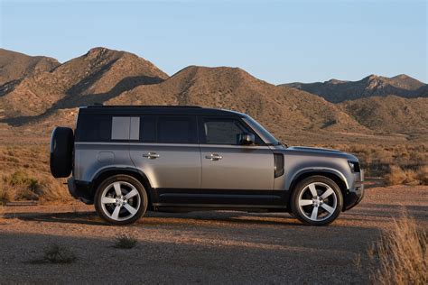 Compared: 2024 Toyota Land Cruiser vs. 2024 Land Rover Defender 110 | Capital One Auto Navigator