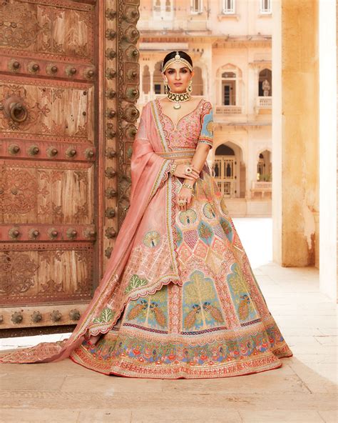 Soft Peach Raw Silk Lehenga Choli In Multi Color Thread Embroidery And