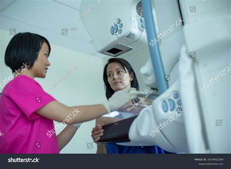 Image of a doctor and a patient reviewing a scan.
