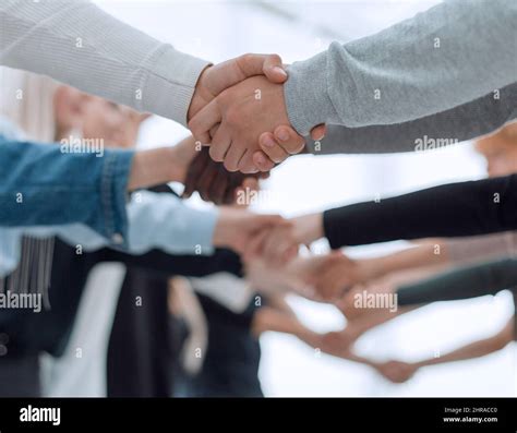 background image of diverse young people shaking hands Stock Photo - Alamy