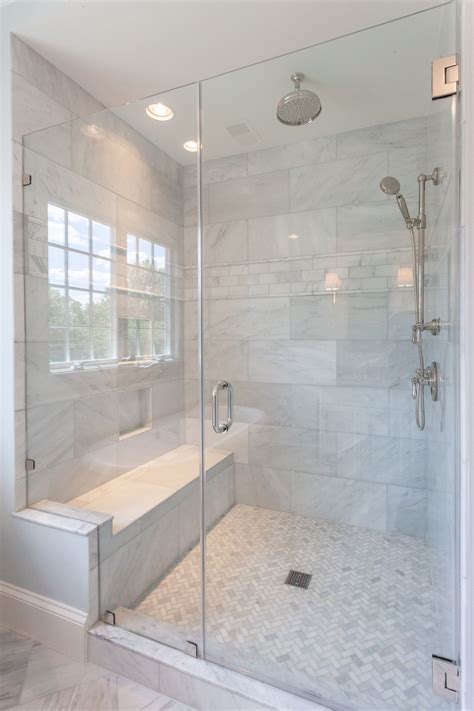 Walk in glass shower with built in shower seat and marble shower walls ...