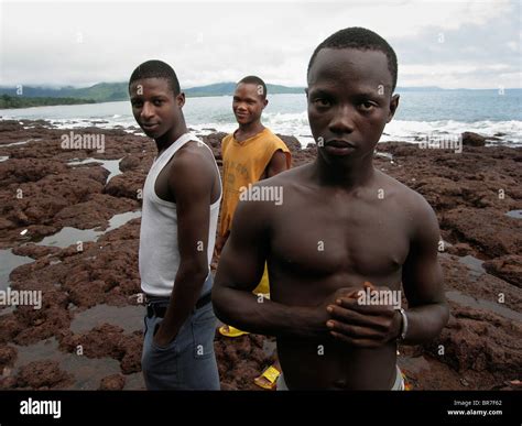 Yound Sierra Leonean men looking tough on the beach Stock Photo - Alamy