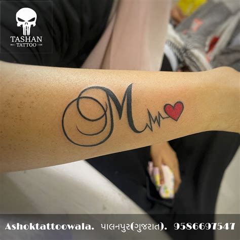 M latter With Heartbeat Tattoo | Name tattoo on hand, M tattoos, Tattoo ...