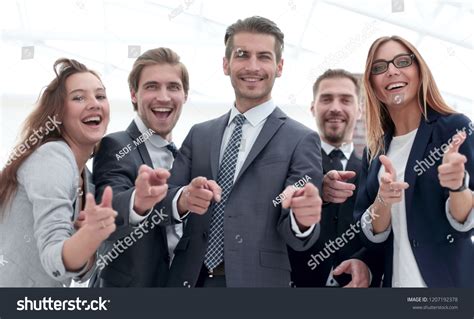 Group of People Standing in Office Pointing 的图像结果