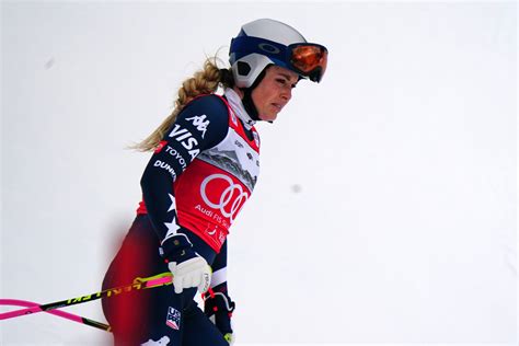 United States' Lindsey Vonn crashes into a gate during an alpine ski women's downhill race, at the 2026 Winter Olympics, in Cortina d'Ampezzo, Italy, Sunday, Feb. 8, 2026. (AP Photo/Jacquelyn Martin)