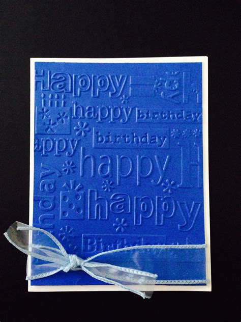 a blue birthday card with a bow on it