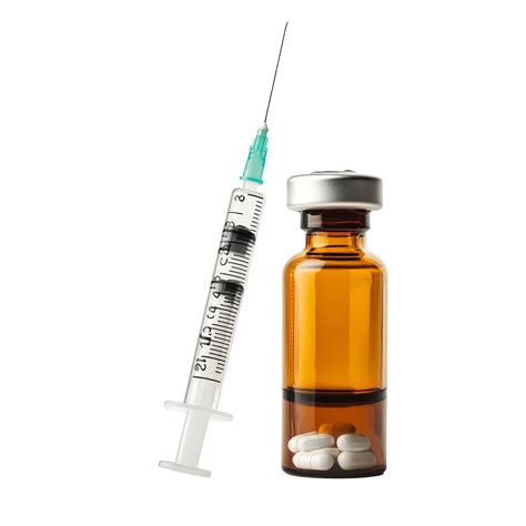 Syringe with clear liquid alongside amber medicine bottle and pills on ...