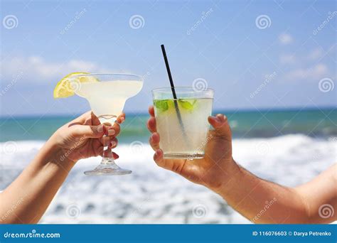 Two Cocktail Glasses in Man and Woman Hands Stock Image - Image of ...