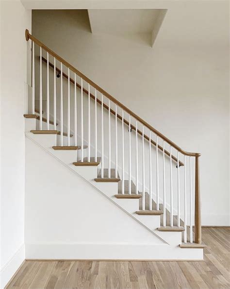 Modern White Staircase with Wooden Handrails