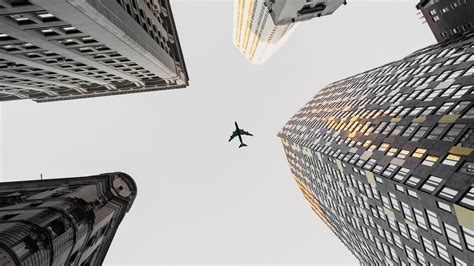 Download wallpaper 1920x1080 plane, buildings, city, bottom view full ...