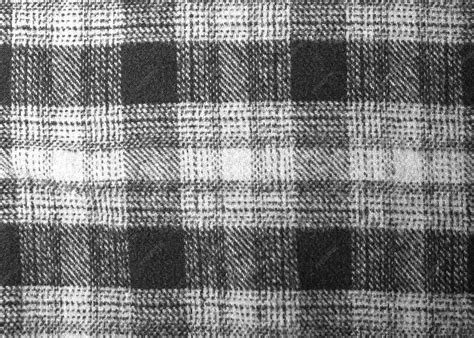 Premium Photo | A black and white plaid fabric with a black and white ...