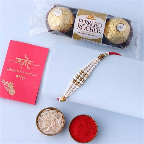 Send Sneh White Pearl Bead Rakhi with Ferrero Rocher Online
