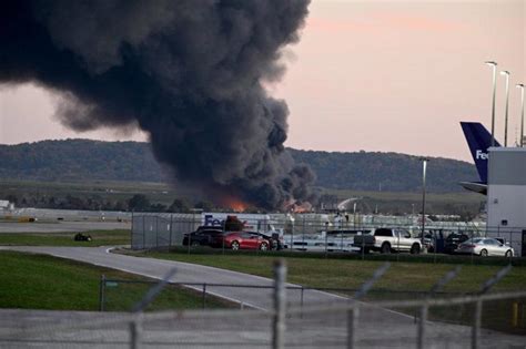 At least three dead after UPS plane crashes in Kentucky, causing huge fire