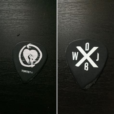 Does anyone know what the symbols on the back of Zach's guitar pick ...