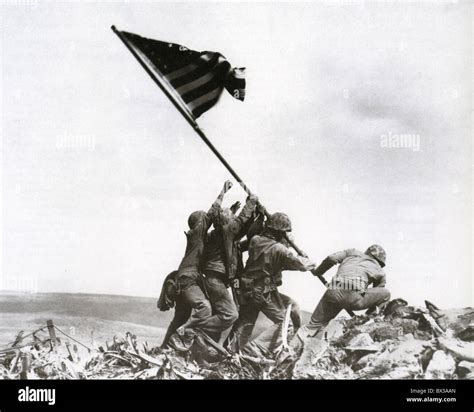 RAISING THE FLAG ON IWO JIMA 23 February 1945. Photo Joe Rosenthal/AP ...