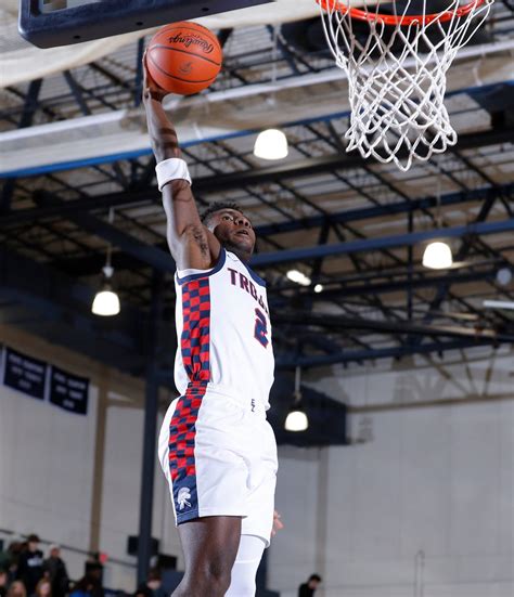 Photos: Okemos at East Lansing boys basketball