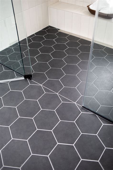 Grey hexagon tile floor curbless shower | Hexagon tile floor, Tile ...