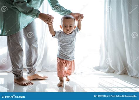 Baby first step stock photo. Image of encouragement - 183726106