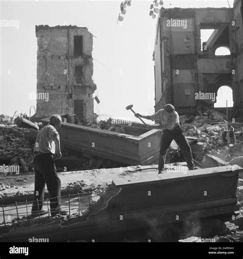 Devastation: Den Haag Two men with sledgehammers engaged in demolition ...