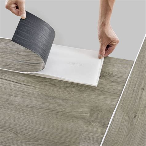 Self adhesive floor tiles