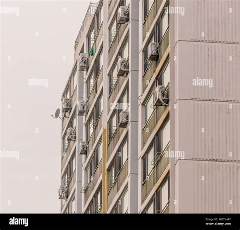 Exterior of an apartment building with air conditioning units installed ...