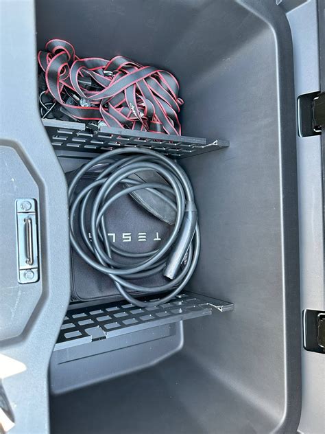 Storing Tesla motorcycle loading ramp in bed bin. | Tesla Cybertruck Forum - Cybertruck Owners Club