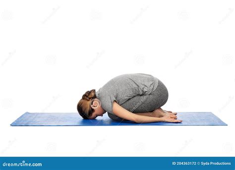 Woman Doing Yoga Child Pose on Mat Stock Photo - Image of person ...