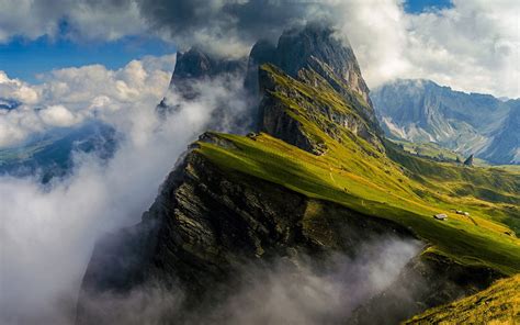 Dolomites Majesty: Cloud-Kissed Mountains of Italy in Stunning HD