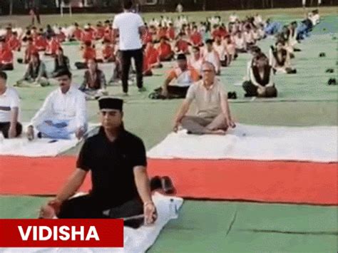 mp leaders stretch bend pose yoga day cm pawan muktasana vijay shah ...