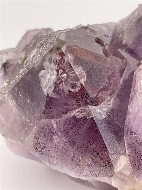 Amethyst, with a layer of red hematite, and a clear quartz cap, with epidote inclusions. Plus! A ...