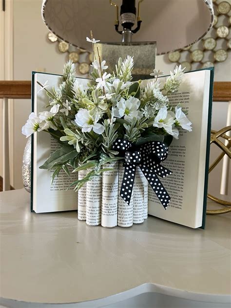 Book centerpiece | Book centerpieces, Old book crafts, Book decor