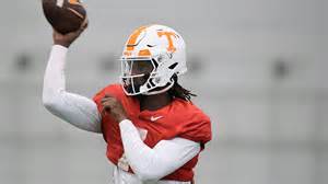 Tennessee quarterback throws orange length of football field.