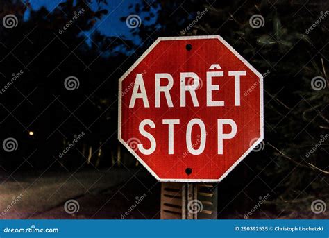 Security Stop Slow Down Sign at Night in Canada Quebec, Arret Means Stop in French Stock Image ...