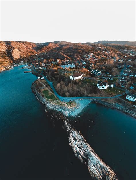 Download wallpaper 3968x5276 island, buildings, relief, trees hd background
