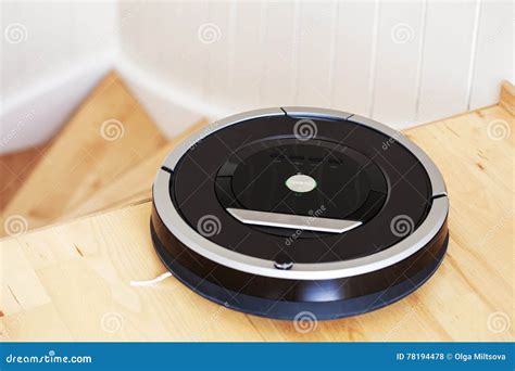 Robotic Vacuum Cleaner on Laminate Wood Floor Smart Cleaning Technology ...