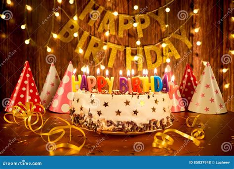 Happy Birthday Cake with Candles on the Background of Garlands a Stock ...