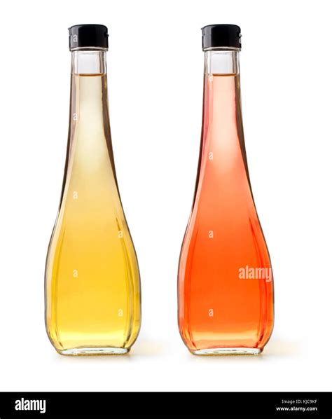 Glass bottles of vinegar isolated on white background Stock Photo - Alamy