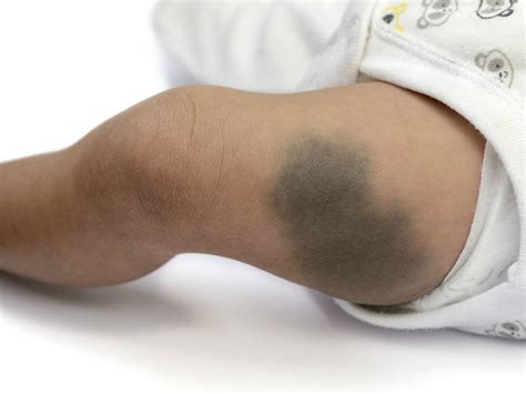 When do babies start holding their own bottle? | BabyCenter