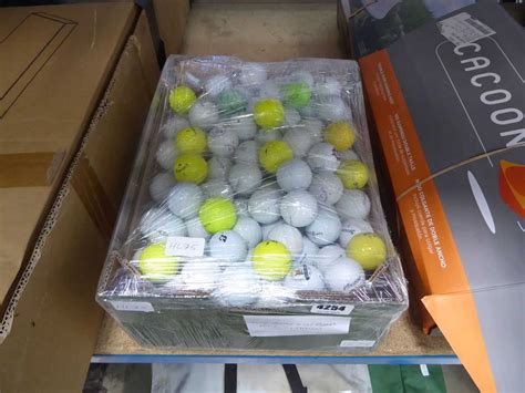 Box containing a quantity of assorted golf balls