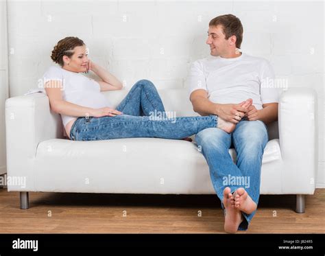 The husband does massage of feet of the pregnant wife of the house ...