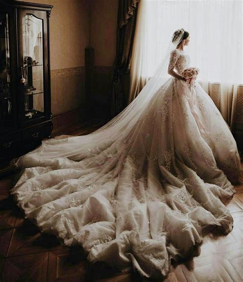 huge and fluffy wedding dress trains like this are the most photogenic and dramatic | Fluffy ...